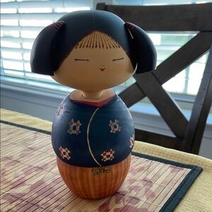 Handcrafted Wooden Doll with Blue and Brown Design